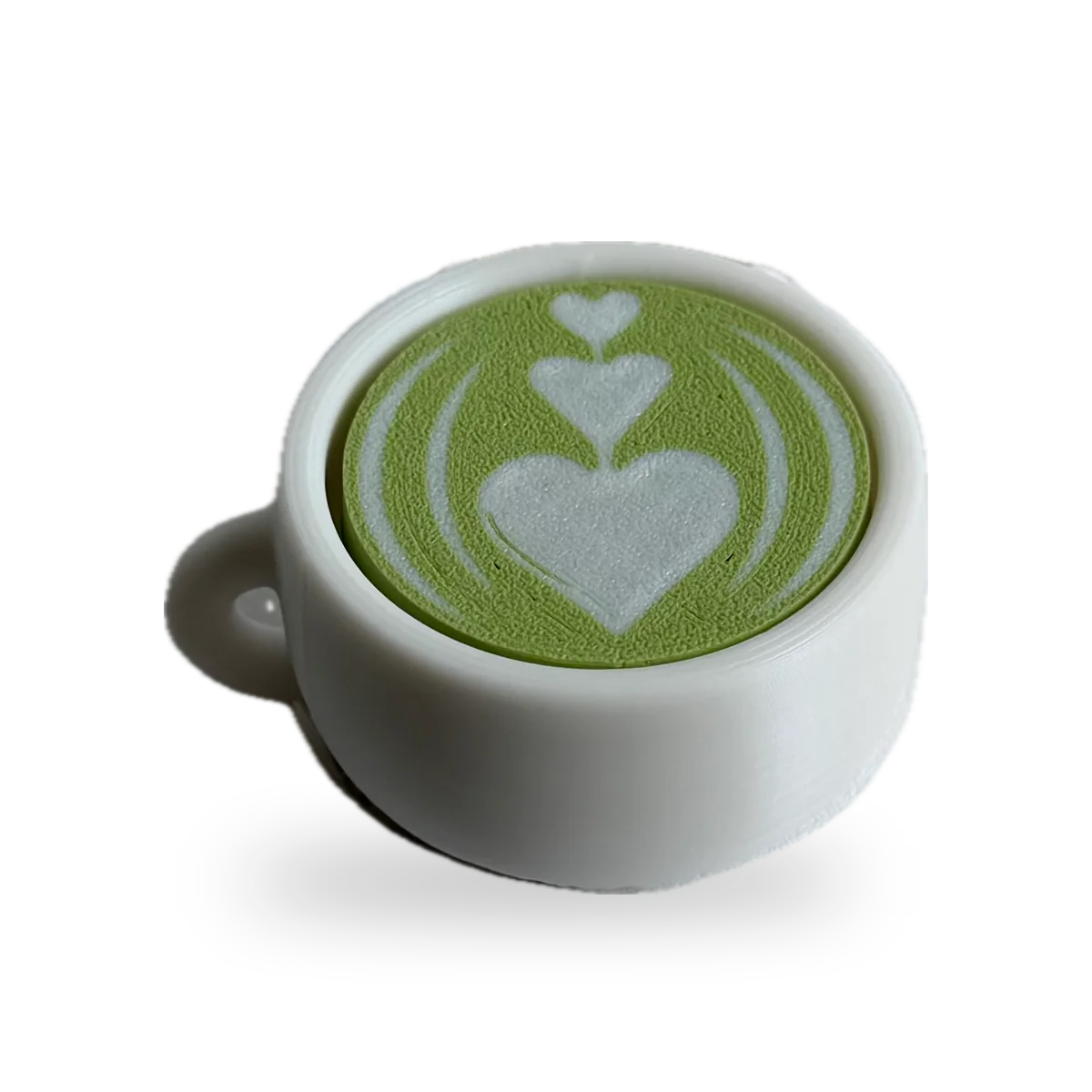 White cup clicker with green matcha latte art
